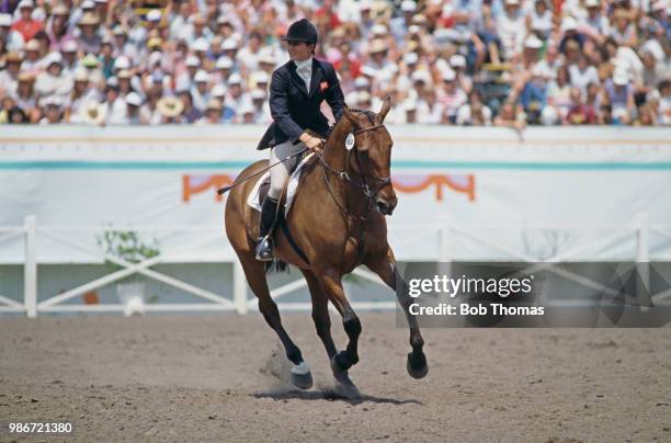 Virginia Holgate of the Great Britain equestrian team rides her horse 'Priceless' in the show jumping discipline of the Mixed Three Day eventing...