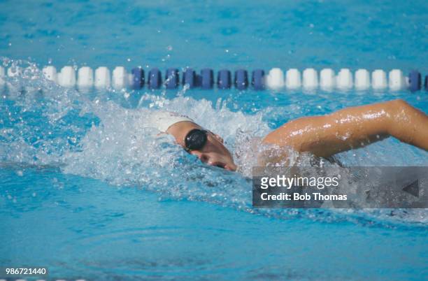 English competitive swimmer June Croft competes for the Great Britain team in the Women's 200 metre freestyle swimming event in the McDonalds Olympic...