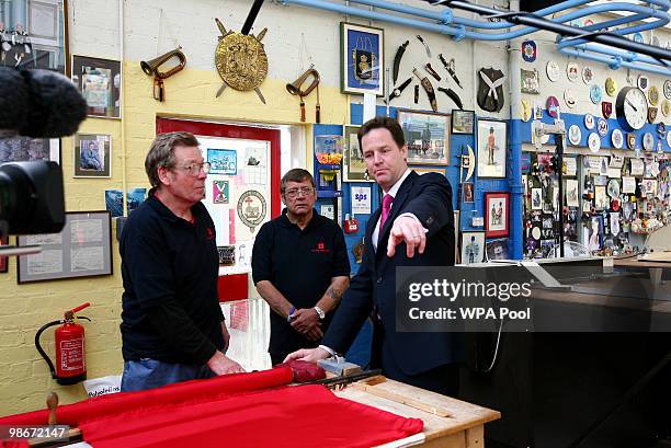 Liberal Democrat leader Nick Clegg speaks with members of staff during an election campaign visit to the Lady Haig Poppy Factory on April 26, 2010 in...