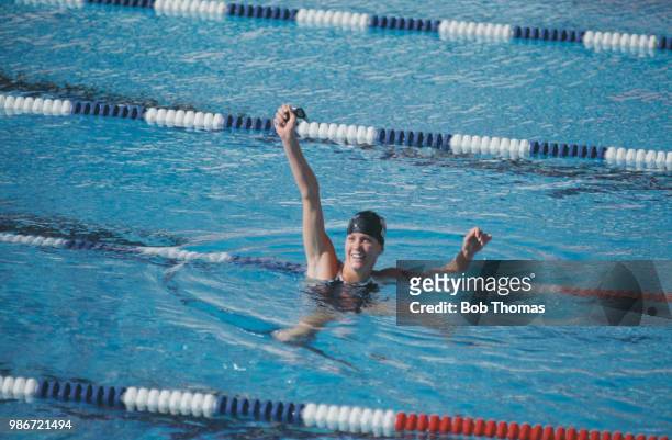 American competitive swimmer Mary Wayte of the United States team celebrates after finishing in first place to win the gold medal in the Women's 200...