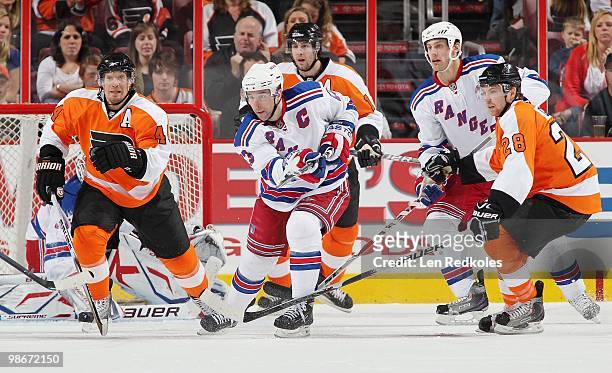 Kimmo Timonen, Simon Gagne and Claude Giroux of the Philadelphia Flyers all do battle with Chris Drury and Dan Girardi of the New York Rangers on...