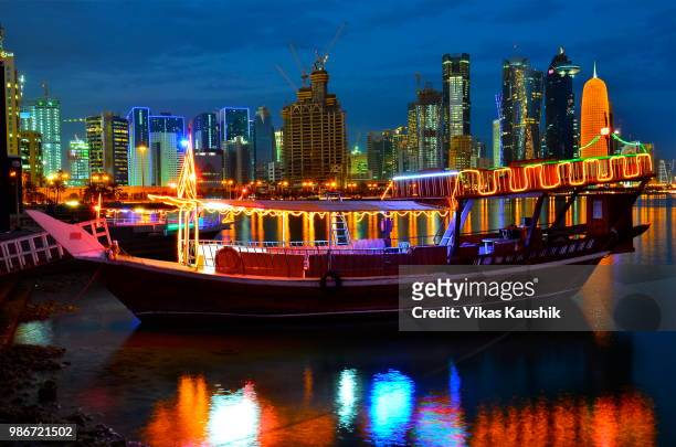 towards lights i sail - dhow qatar stock pictures, royalty-free photos & images