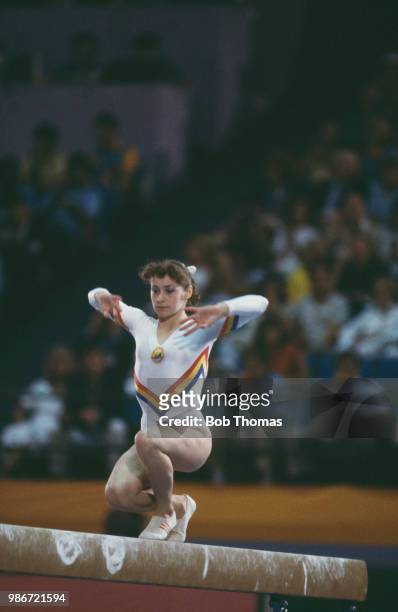 Ecaterina Szabo of Romania competes in the women's balance beam competition of the artistic gymnastics events at the 1984 Summer Olympics in Los...