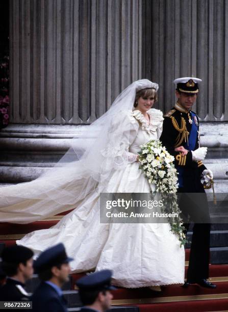 Prince Charles, Prince of Wales and Diana, Princess of Wales, wearing a wedding dress designed by David and Elizabeth Emanuel and the Spencer family...