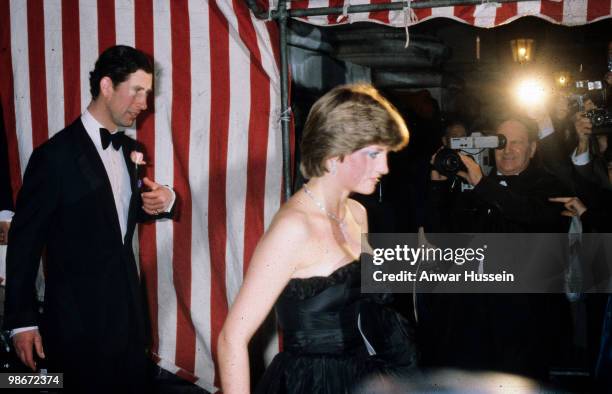 Prince Charles, Prince of Wales and his fiance, Lady Diana Spencer, wearing a strapless black taffeta dress designed by David and Elizabeth Emanuel,...