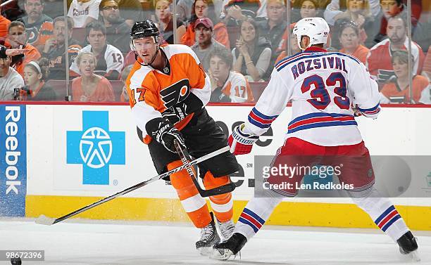 Jeff Carter of the Philadelphia Flyers slaps the puck past Michal Rozsival of the New York Rangers on April 11, 2010 at the Wachovia Center in...