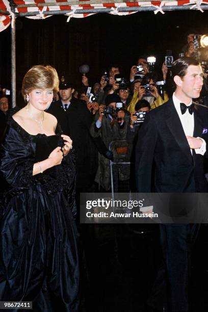 Prince Charles, Prince of Wales and his fiance, Lady Diana Spencer, wearing a strapless black taffeta dress designed by David and Elizabeth Emanuel,...