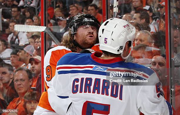 Scott Hartnell of the Philadelphia Flyers is checked to the face by Dan Girardi of the New York Rangers on April 11, 2010 at the Wachovia Center in...