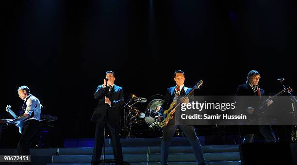 Gary Kemp,Tony Hadley, Martin Kemp and Steve Norman of Spandau Ballet perform as part of their comeback tour at the O2 Arena on October 20, 2009 in...