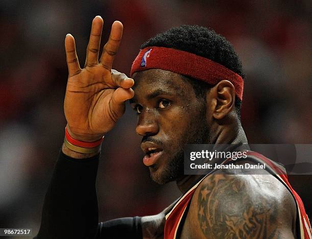 LeBron James of the Cleveland Cavaliers signals to teammates after making a three-point shot against the Chicago Bulls in Game Four of the Eastern...