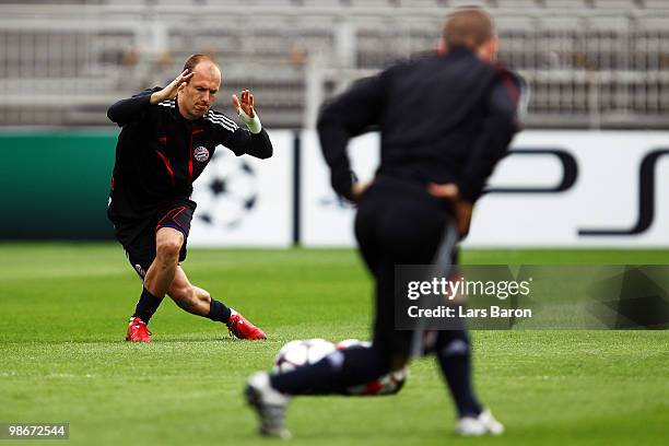 Arjen Robben stretches during a Bayern Muenchen training session at Stade de Gerland on April 26, 2010 in Lyon, France. Muenchen will play against...