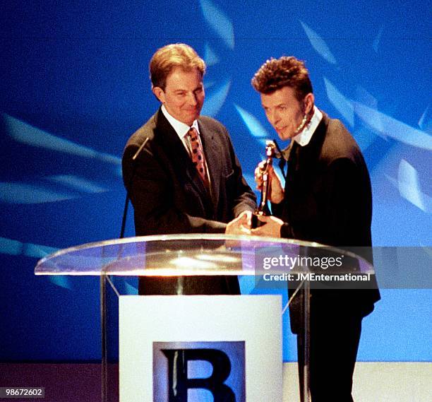 Labour Leader of the Opposition Tony Blair presenting an outstanding contribution award to David Bowie at the Brit Awards at Earls Court on February...