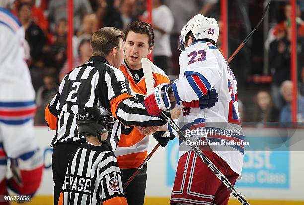 Retiring referee Kerry Fraser shakes the hands of Mike Richards of the Philadelphia Flyers and Chris Drury of the New York Rangers prior to the start...