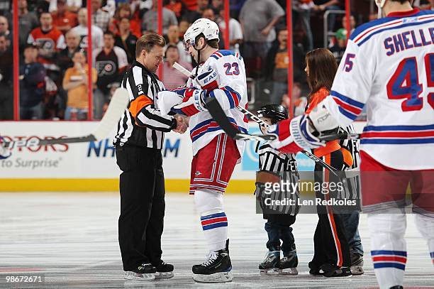 Retiring referee Kerry Fraser shakes the hand of Chris Drury of the New York Rangers prior to the start of his last regular season game on April 11,...