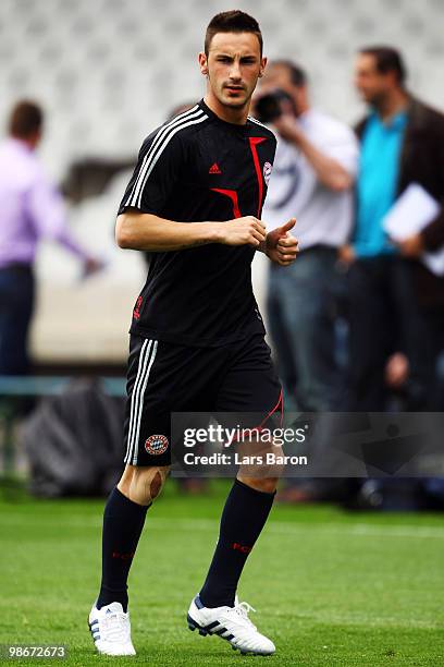 Diego Contento warms up during a Bayern Muenchen training session at Stade de Gerland on April 26, 2010 in Lyon, France. Muenchen will play against...