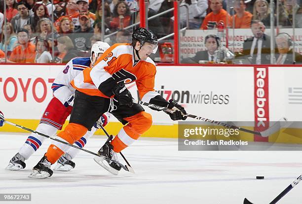 James van Riemsdyk of the Philadelphia Flyers skates the puck across the blue line against a member of the New York Rangers on April 11, 2010 at the...