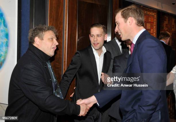 Prince William meets photographer Rankin as he attends a Royal Gala reception for 'A Positive View on April 15, 2010 at ChristieÕs in London,...