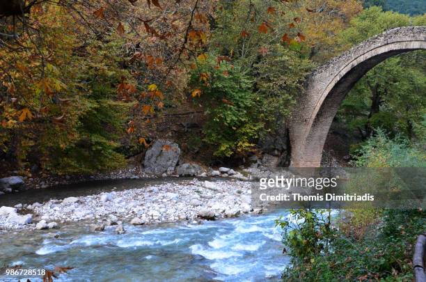 plaka stone bridge - themis stock pictures, royalty-free photos & images