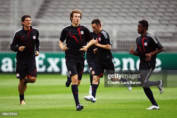 Mario Gomez, Holger Badstuber, Ivica Olic and David Alaba warm during a Bayern Muenchen training session at Stade de Gerland on April 26, 2010 in...