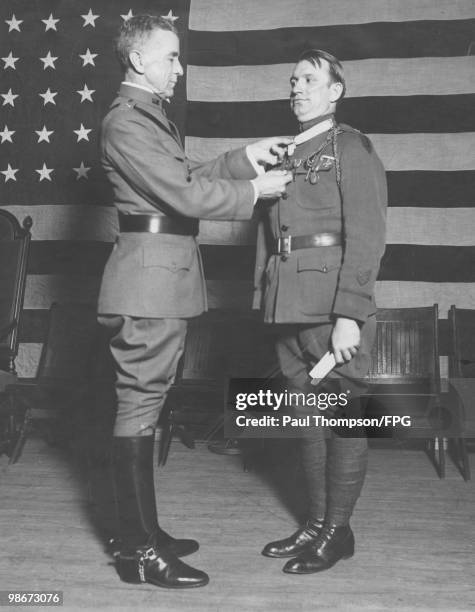 The decoration of US war heroes takes place in New York Town Hall, under the auspices of the Soldiers' and Sailors' Club of New York, 6th April 1923....