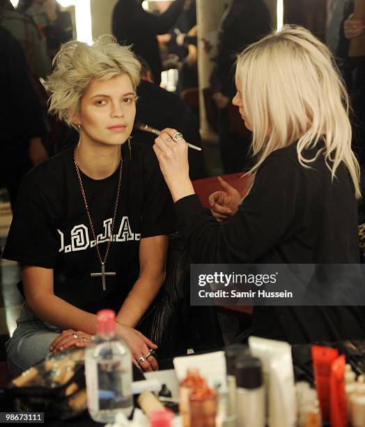 Model Pixie Geldof prepares backstage during the Vivienne Westwood Red Label fashion show during London Fashion Week on February 21, 2010 in London,...