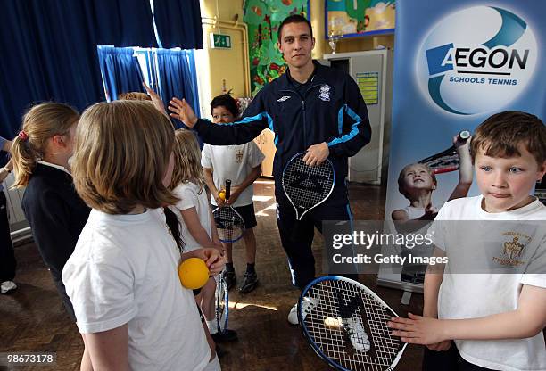 Birmingham City football player Mitch McPike talks to the kids during a tennis activity at an AEGON schools visit to Moseley C of E Primary school on...