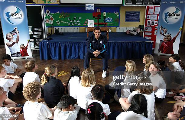 Birmingham City football player Mitch McPike talks to the kids during a tennis activity at an AEGON schools visit to Moseley C of E Primary school on...