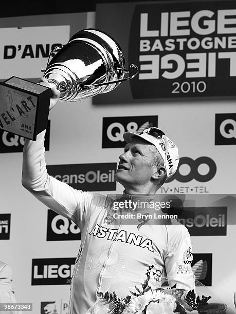 Alexandre Vinokourov of Astana and Kazakhstan poses with the race winners' trophy after winning the 96th Liège-Bastogne-Liège race on April 25, 2010...