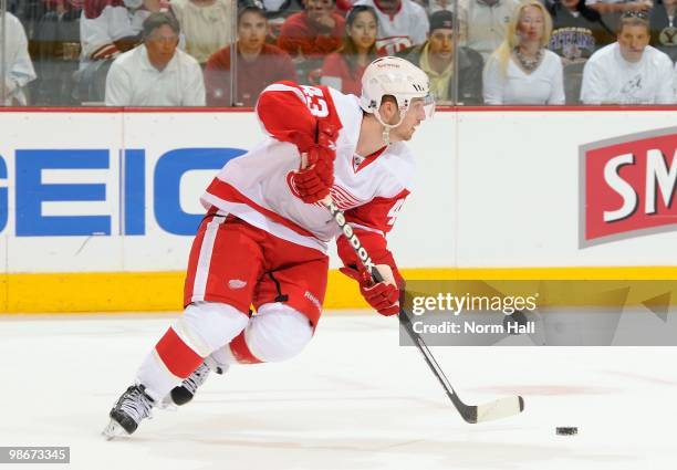 Darren Helm of the Detroit Red Wings skates the puck up ice against the Phoenix Coyotes in Game Five of the Western Conference Quarterfinals during...