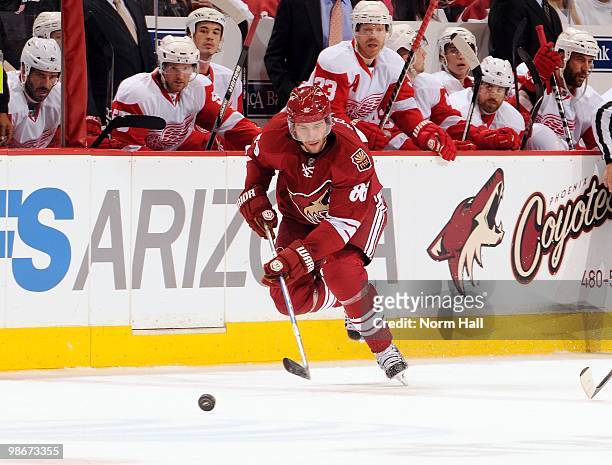 Wojtek Wolski of the Phoenix Coyotes skates the puck past the Detroit Red Wings bench in Game Five of the Western Conference Quarterfinals during the...