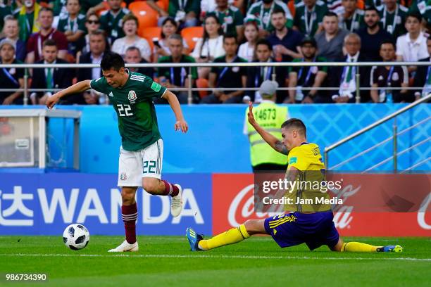 Hirving Lozano of Mexico fights for the ball with Mikael Lustig of Sweden during the 2018 FIFA World Cup Russia group F match between Mexico and...