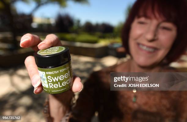 Kyle Johnson, co-chair of the Cannabis Discussion Club, holds up a medicinal marijuana product at Trilogy at the Vineyards in Brentwood, some 55...