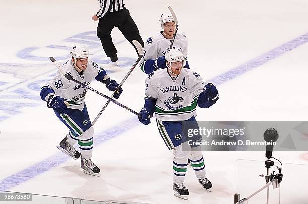 Shane O'Brien and Henrik Sedin of the Vancouver Canucks celebrate after a goal against the Los Angeles Kings in Game Four of the Western Conference...