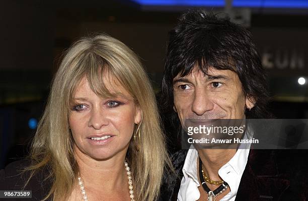 Ronnie Wood of The Rolling Stones arrives with his wife Jo Wood at the royal premiere of the film Enigma on September 24, 2001 in London, England.