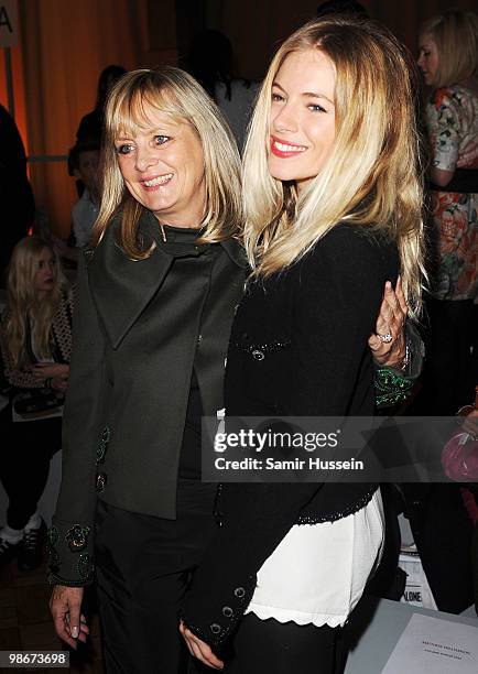 Sienna Miller and model Twiggy Lawson attend the Matthew Williamson fashion show during London Fashion Week on February 21, 2010 in London, England.