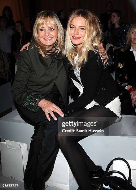 Sienna Miller and model Twiggy Lawson attend the Matthew Williamson fashion show during London Fashion Week on February 21, 2010 in London, England.