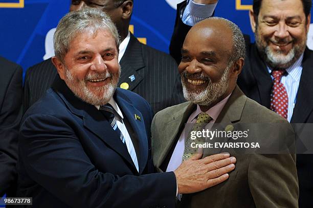 Brazil's President Luiz Inacio Lula da Silva and Haiti's President Rene Preval pose for the family photo the I Brazil-Caribbean Community Heads of...