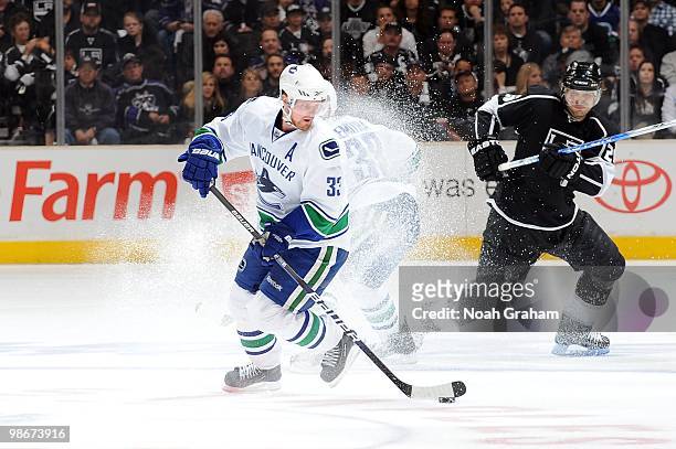 Henrik Sedin of the Vancouver Canucks skates with the puck against the Los Angeles Kings in Game Four of the Western Conference Quarterfinals during...