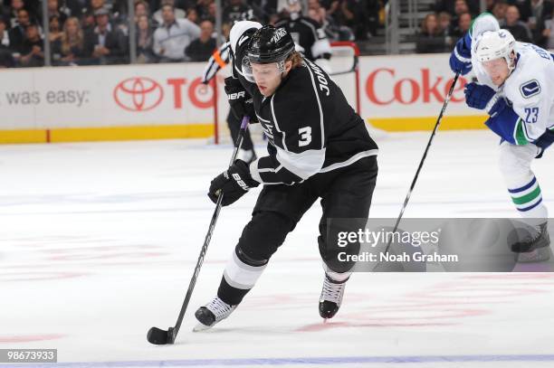 Jack Johnson of the Los Angeles Kings skates with the puck against the Vancouver Canucks in Game Four of the Western Conference Quarterfinals during...