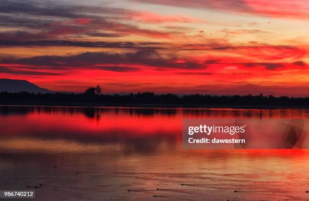 mekong river sunrise, champasak, laos - champasak stock pictures, royalty-free photos & images