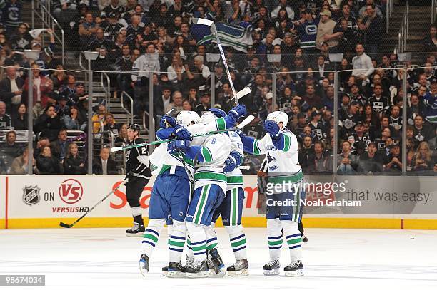 The Vancouver Canucks celebrate after a goal against the Los Angeles Kings in Game Four of the Western Conference Quarterfinals during the 2010 NHL...