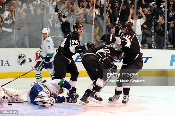 Ryan Smyth, Wayne Simmonds and Anze Kopitar of the Los Angeles Kings celebrate after a goal against the Vancouver Canucks in Game Four of the Western...