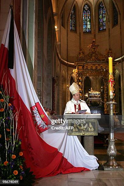 Head of Polish church archbishop Henryk Muszynski conducts a mass on April 11, 2010 in Gniezno, central Poland, the day after a plane carrying Polish...