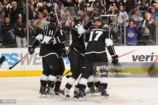 Anze Kopitar, Ryan Smyth and Wayne Simmonds of the Los Angeles Kings celebrate after a goal against the Vancouver Canucks in Game Four of the Western...