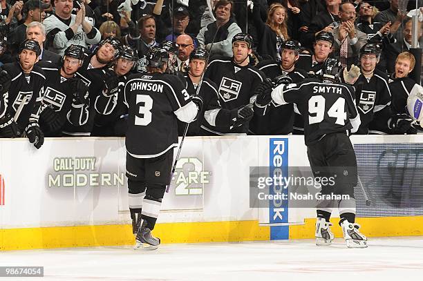 Jack Johnson and Ryan Smyth of the Los Angeles Kings celebrate with the bench after a goal against the Vancouver Canucks in Game Four of the Western...