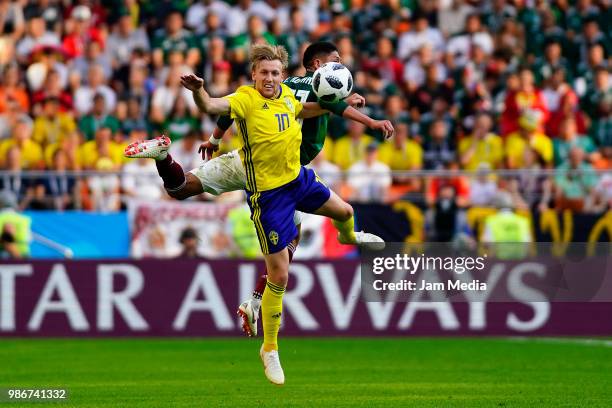 Emil Forsberg of Sweden fights for the ball with Edson Alvarez of Mexico during the 2018 FIFA World Cup Russia group F match between Mexico and...