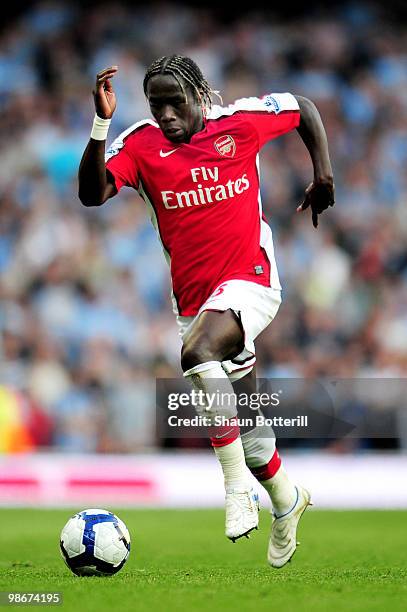 Bacary Sagna of Arsenal runs with the ball during the Barclays Premier League match between Arsenal and Manchester City at the Emirates Stadium on...