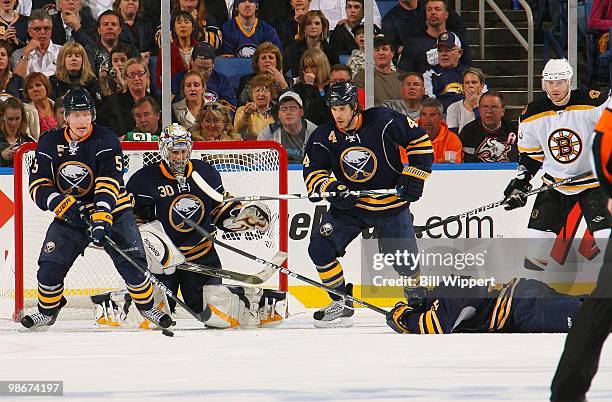 Michael Grier of the Buffalo Sabres gets hit in the head blocking a shot by the Boston Bruins in Game Five of the Eastern Conference Quarterfinals...