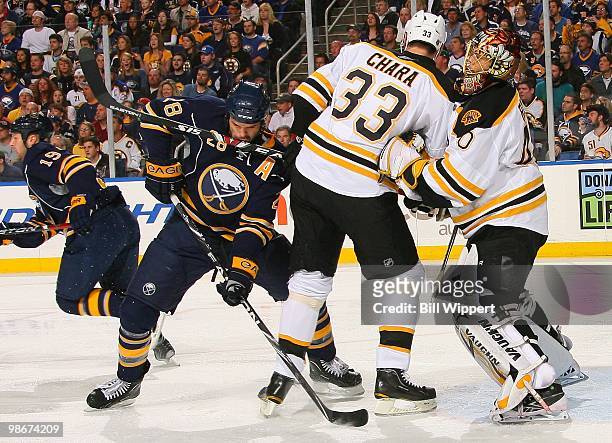 Paul Gaustad of the Buffalo Sabres gets hit by the stick of Zdeno Chara of the Boston Bruins in Game Five of the Eastern Conference Quarterfinals...