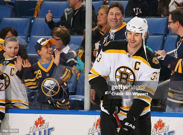 Zdeno Chara of the Boston Bruins draws smiles from fans while warming up to play against the Buffalo Sabres in Game Five of the Eastern Conference...